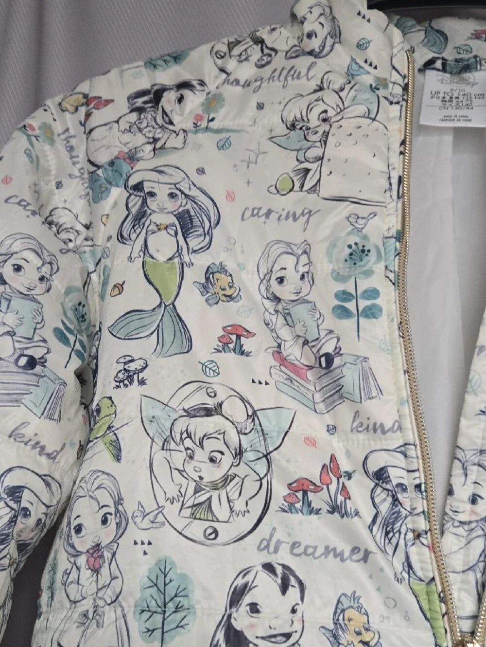 Disney Quilted Puffer Jacket with Cream Background and Pastel Accents